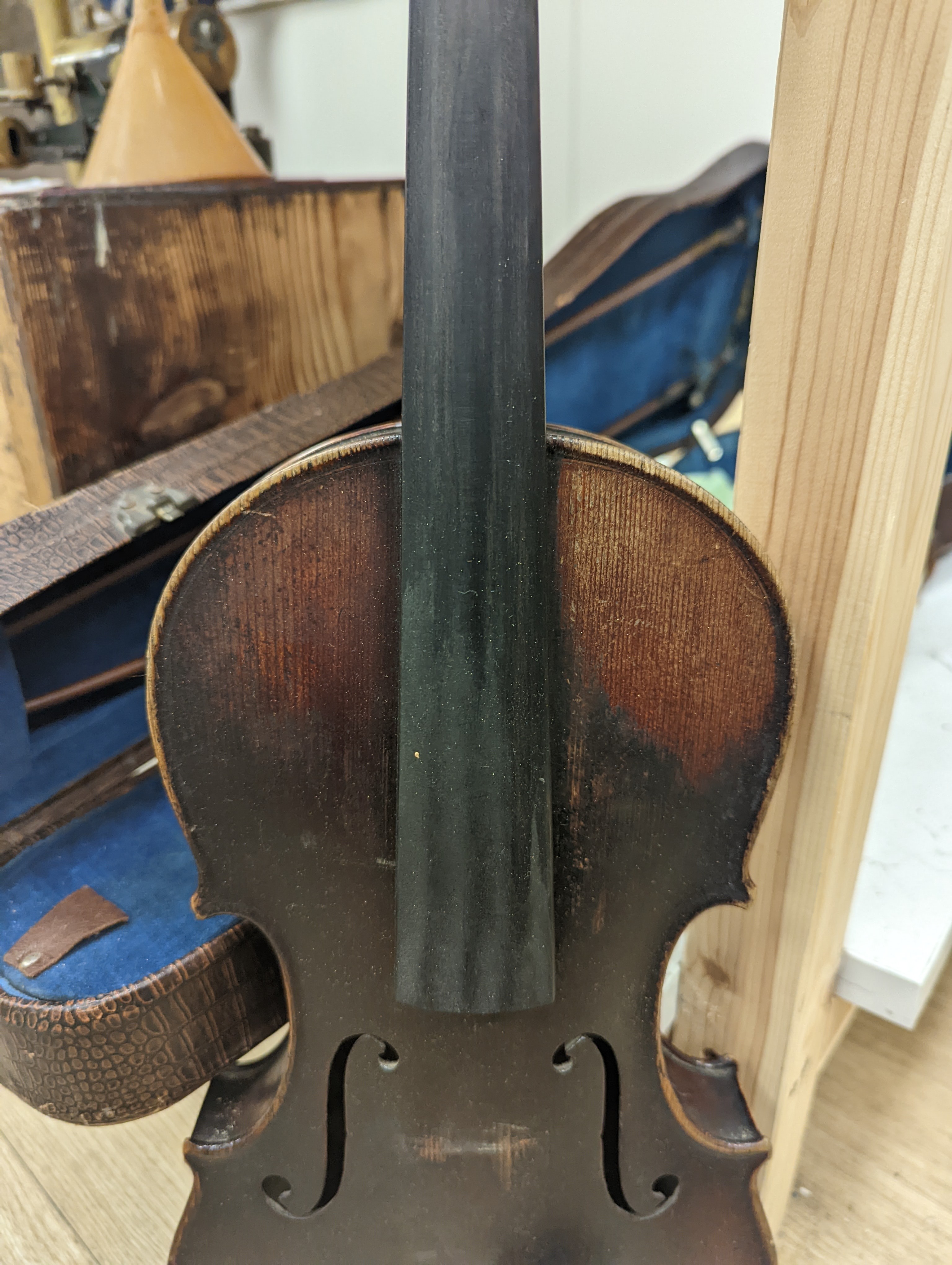 A late 19th century German violin and two bows, cased